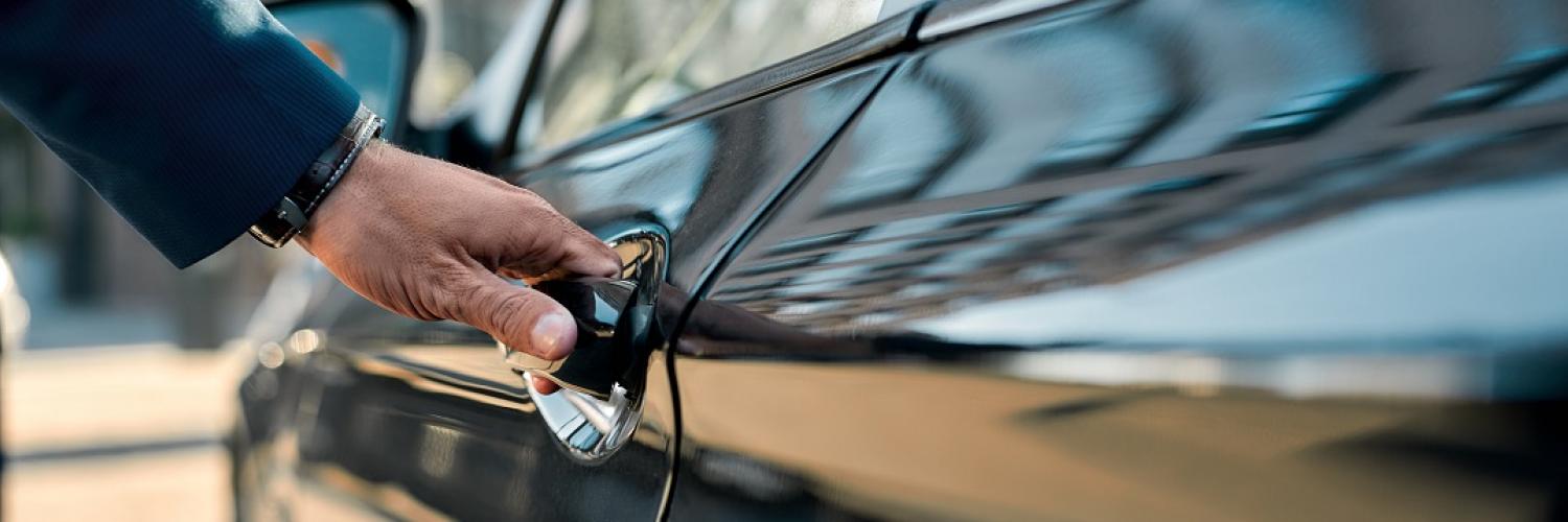 image of man opening car door