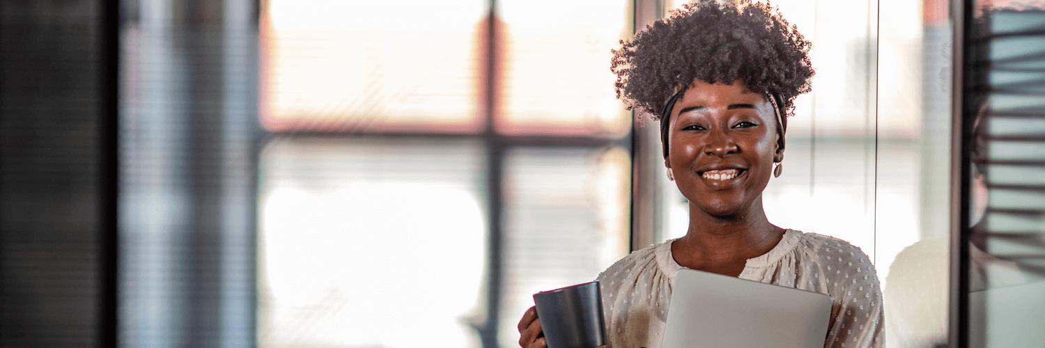 Woman smiling with coffee Woman smiling with coffee