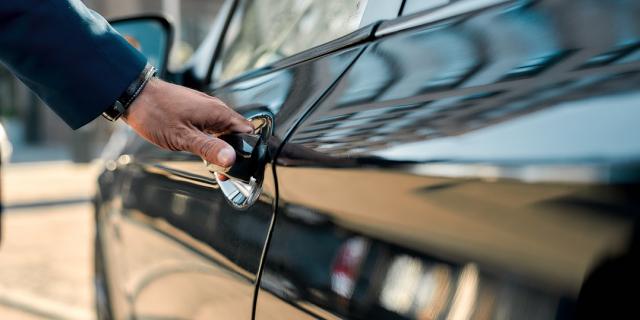 image of man opening car door