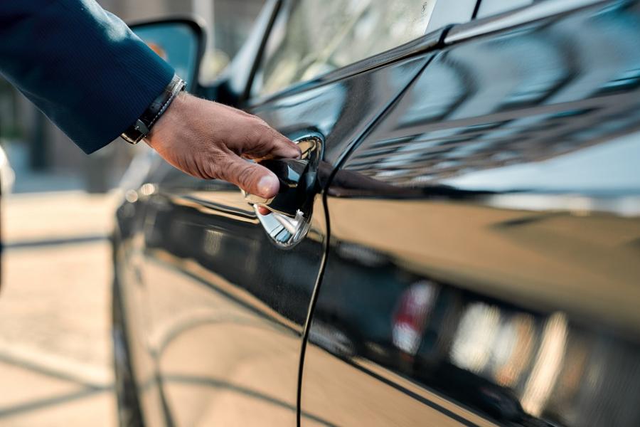 image of man opening car door
