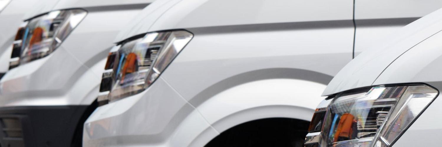 image of white van fleet