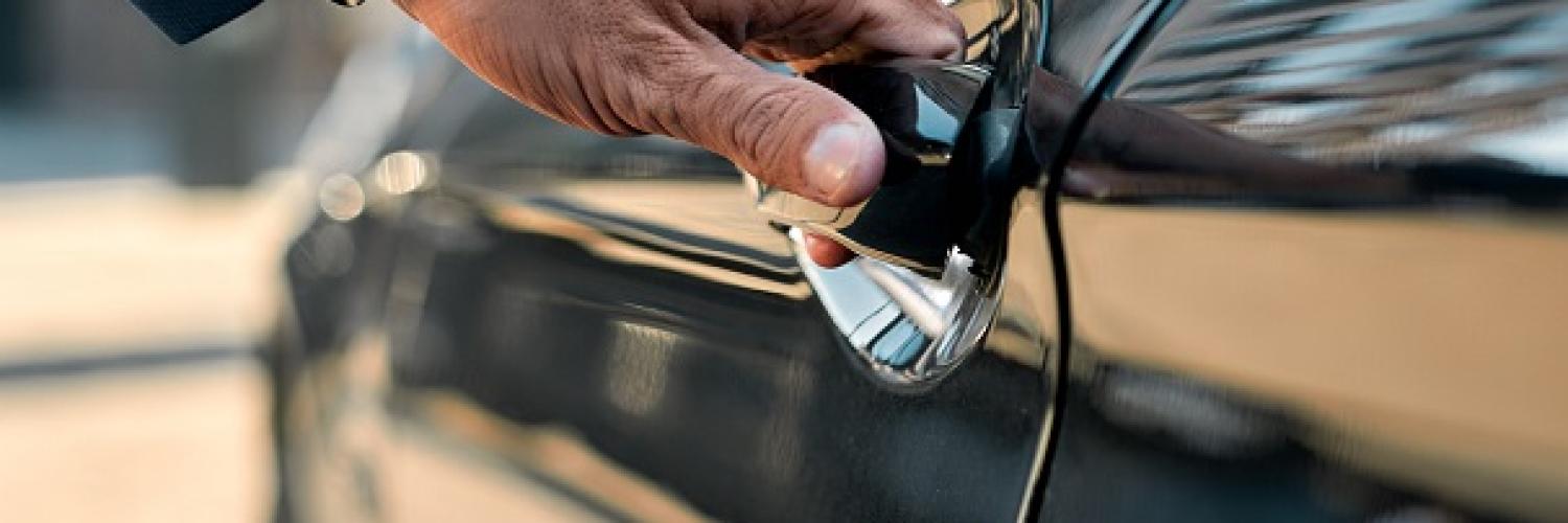 image of man opening car door